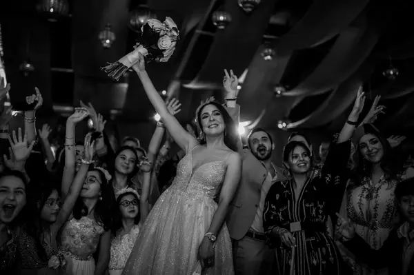 Bride bouquet toss celebration black and white - marrakech wedding photographer
