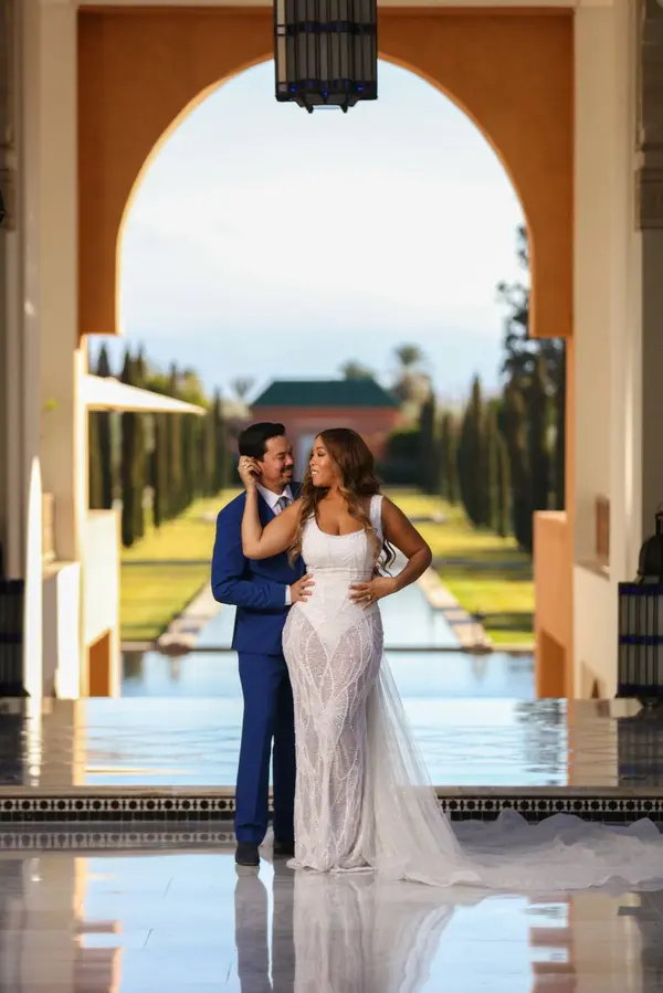 Bride and groom portrait luxury resort arch - photographer marrakech
