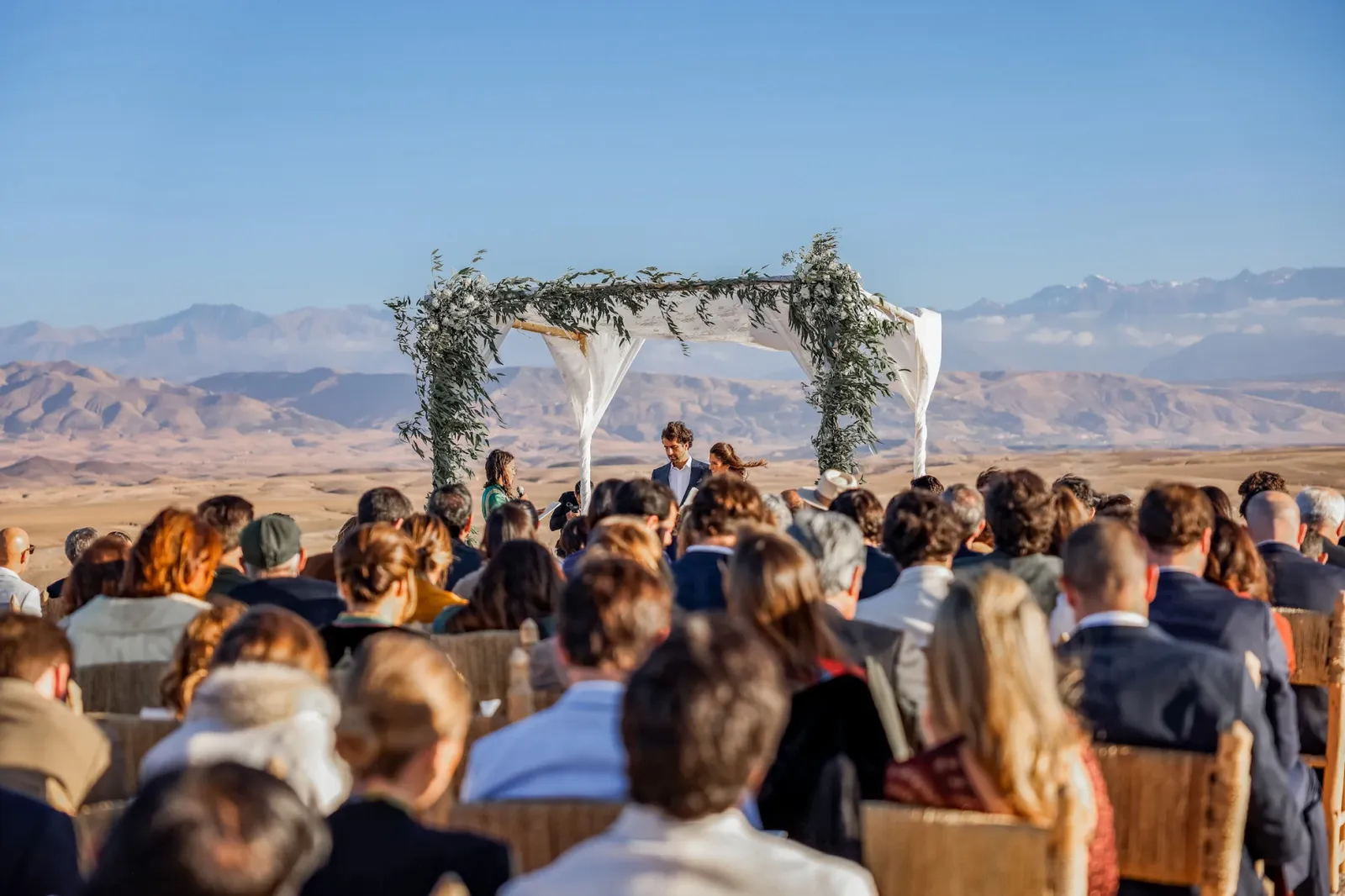 Couple at destination wedding in Morocco with Atlas Mountains backdrop - destination wedding photographer